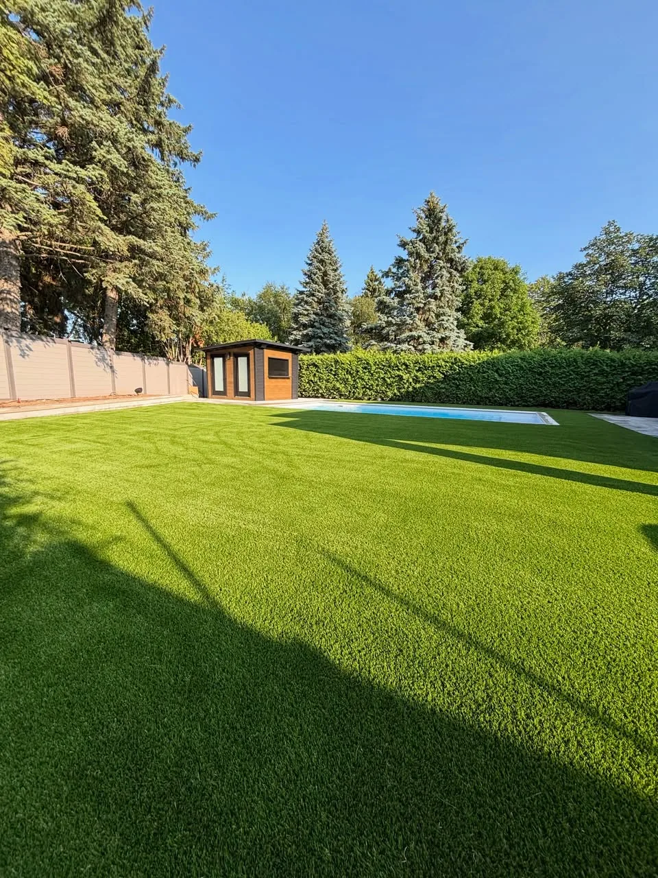 Wide artificial grass lawn installation in Ajax